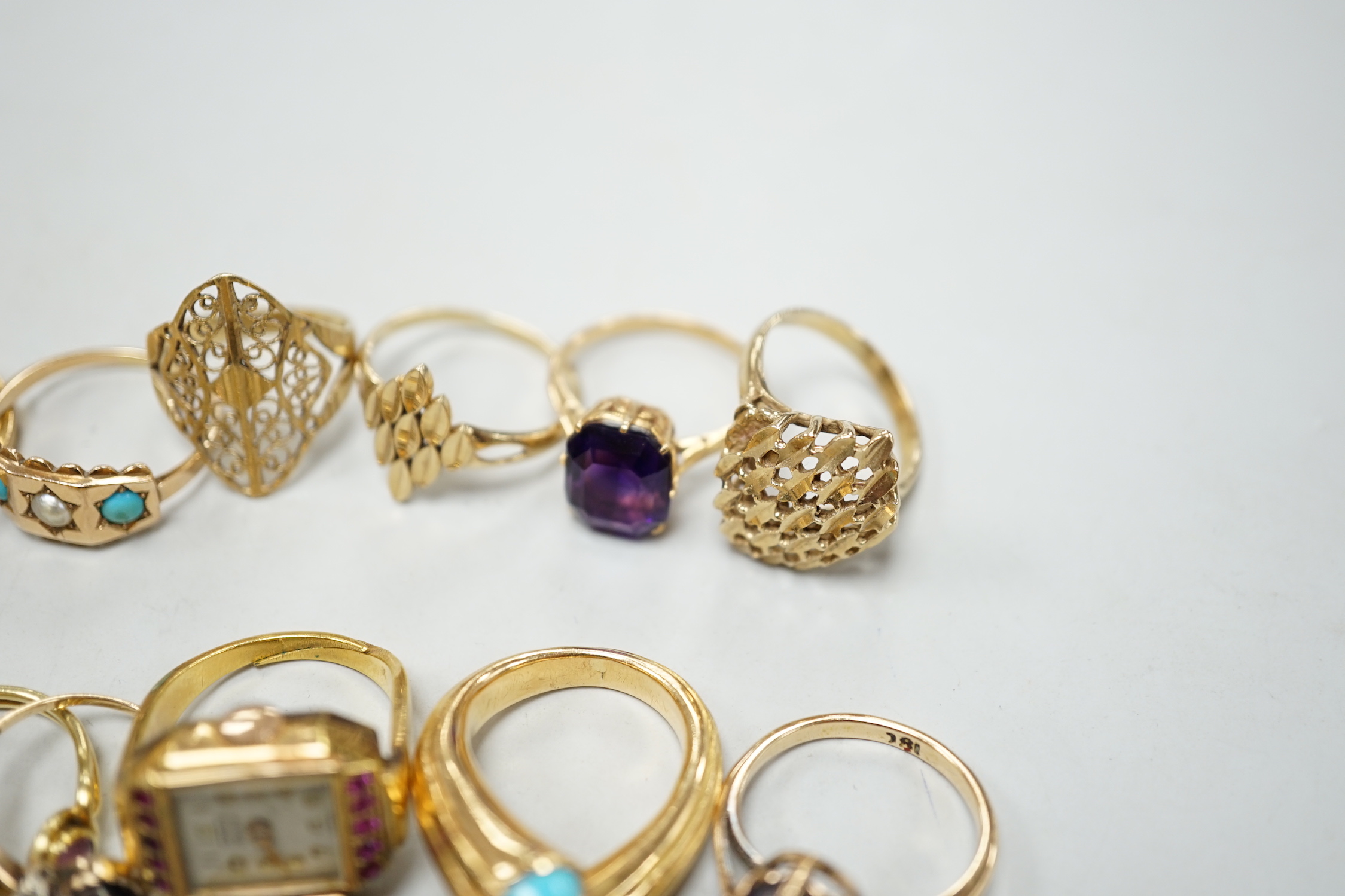 Three 18ct and gem set rings including star sapphire, turquoise and pearl and ruby and diamond three stone, five 9ct gold rings and a 9ct gold pendant mount and nine other rings including ring watch and Middle Eastern tu